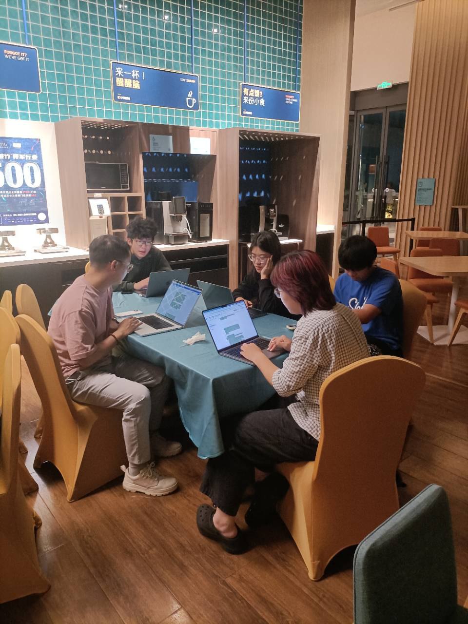 Students working at a table inside the Children's Home
