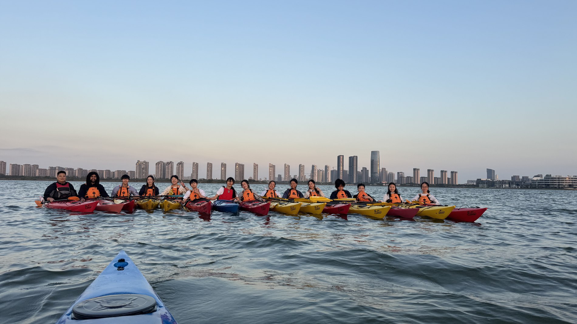 Dragon boat kayaking on the lake at sunset