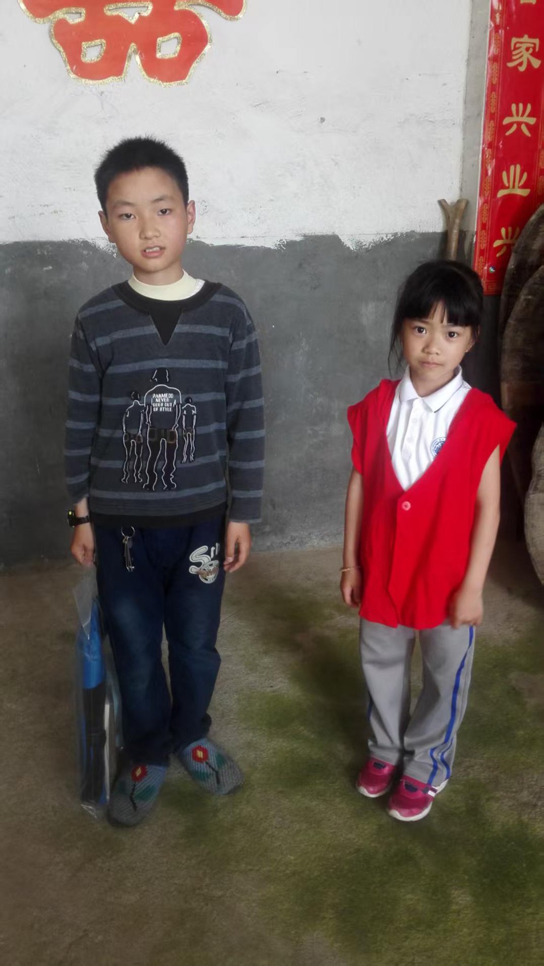 Two children outside a home in the mountains outside Wenzhou